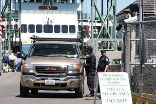 U.S. Customs agents inspecting cars coming off the international ferry at the Friday Harbor ferry terminal.