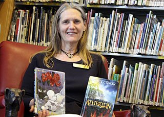 Nita Couchman with some of the book club's recent selections.