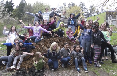 Teacher Mandy Randolph (far left) and Orcas students are very happy with the donation to their school garden.