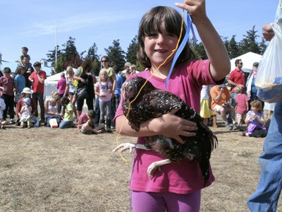 A 4-H Fur and Feathers club member at the county fair.