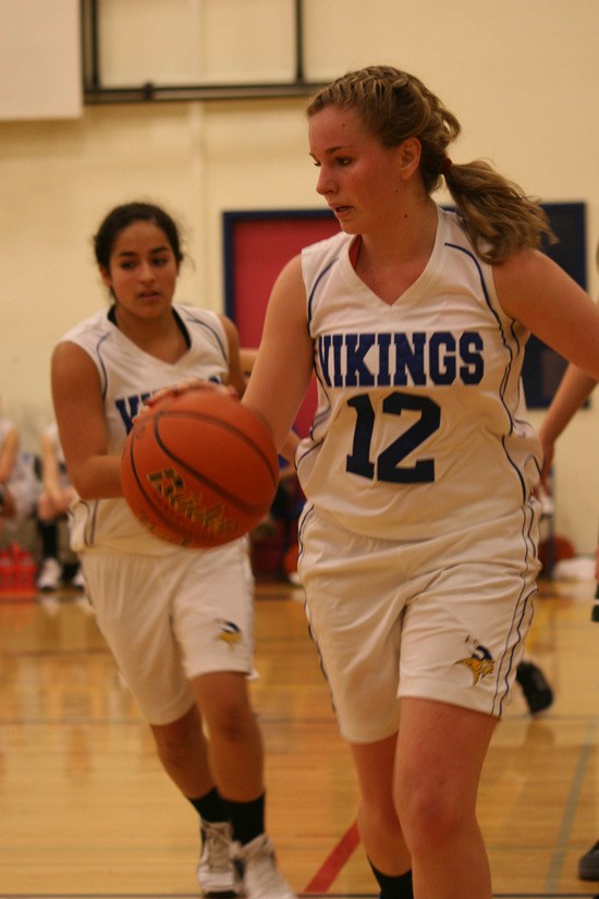 Shelbi Rogers drives the ball; Aliviah Garcia is pictured in the back.