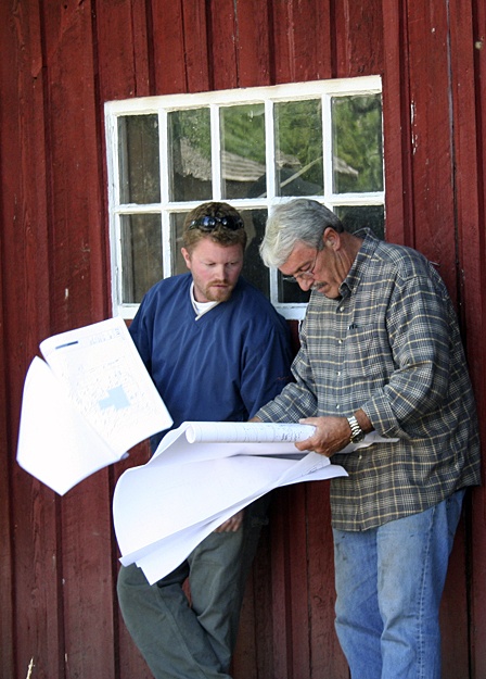 Contractors examine construction plans Aug. 11 at a mandatory job walk for the new fire station.