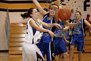 Players scramble for the ball on the rebound.