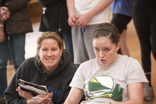 Coach Tina Brown encouraging Varsity Rower Melanie Flint.