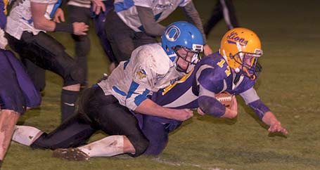 Viking Joey Susol tackles a Lion during the game against Concrete on Nov. 1