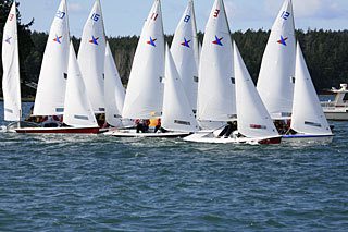 The Orcas sailing crew prepares to participate in the upcoming race.