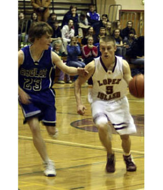 Lobo Colton Jardine goes up against an Eagle defender.