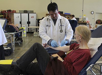 Robin Becker giving blood on Aug. 1.