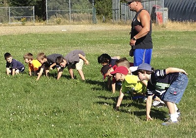 Coach Justin Frausto with the pee wee level players.