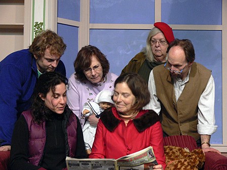 The 'guests' of the Cloisters look at the newspaper. Left to right: Zach Knight