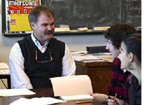 Principal Roland MacNichol with students at Lopez School.