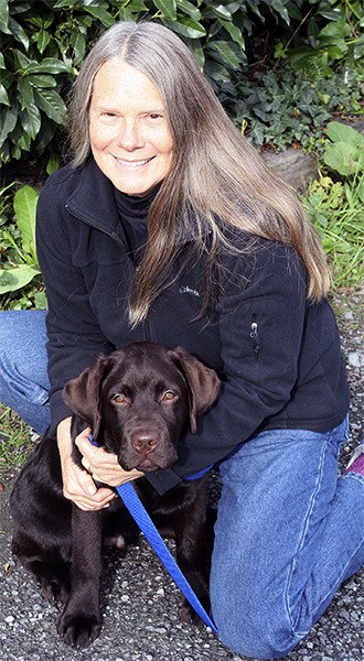 Mary Ann Sircely with her four-month-old lab Rollo Left: The cover of Bucks County Woman