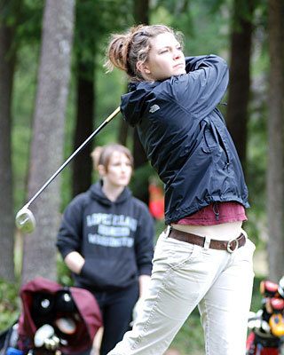 Emily Post van der Burg drives on hole #6 as Sydney Hoffman (left background) watch her ball.