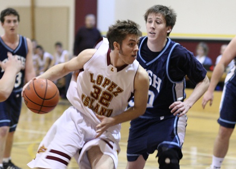 Lobo Mica Arps works it down the court against Bush.