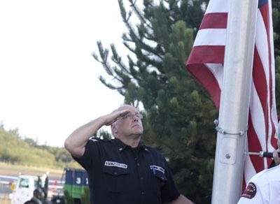 Orcas Island Fire and Rescue gather today to observe Sept. 11.