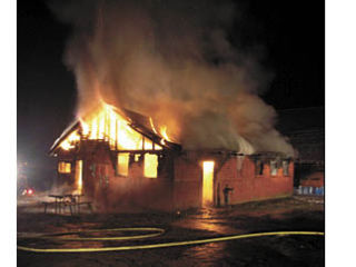 The house engulfed in flames on Thursday