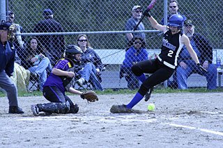 Lady Viking Alison O’Toole moves fast to get out of the way of a foul ball.