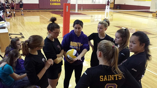 Coach Davis addresses the Saints during a time out.