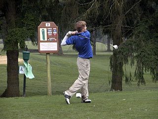 Orcas boys team member takes a shot down the fairway.