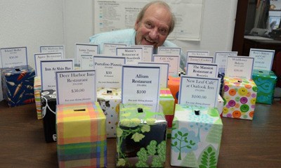 OFHC board president Ken Speck with 22 raffle boxes.