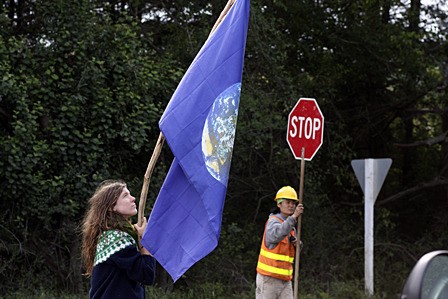 Callie North protesting the chip sealing.