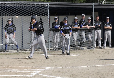 The Viking boys batting lineup waits in anticipation as a pitch comes hurtling in.