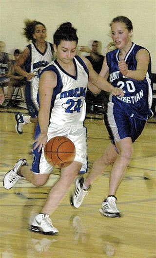 The Lady Vikings run it down the court.