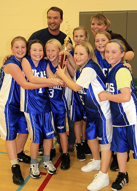 Fifth grade girls team with their first place tournament trophy. Front row from left to right: Eve Hance