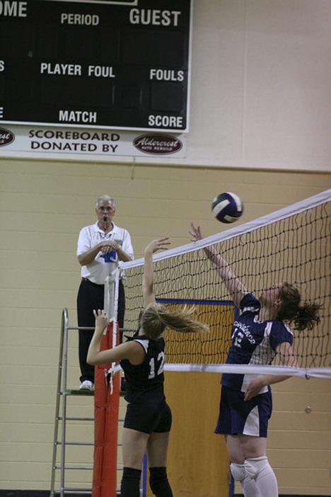 Lopez Lobo Sarah Stanley just tips it over the net to the opposing team.