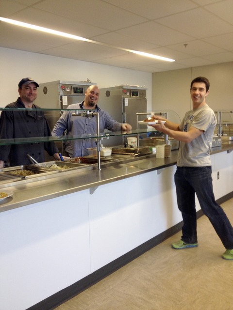 Chef Zach and Chef Madden serving lunch to high school student Pasha Bullock