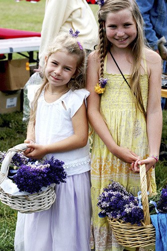 Molina Stone (l) and Lokahi Anuenue (r) selling lavender at a previous market.