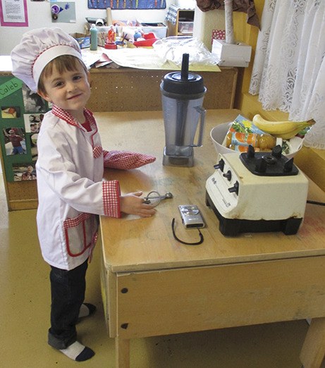 Gus (whose family owns Deer Harbor Inn Restaurant) prepares to make a fruit smoothie for the preschool class at Children’s House.