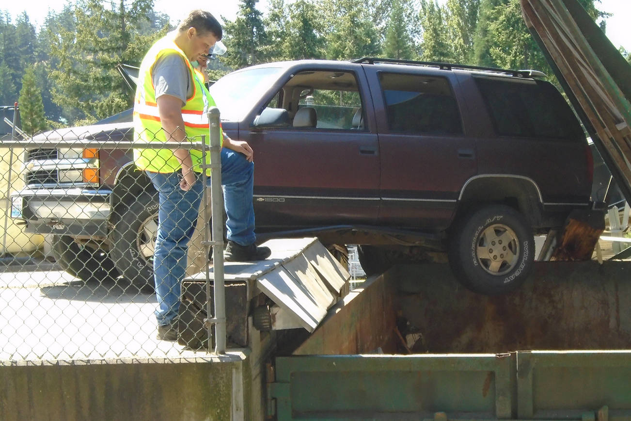 SUV dangles dangerously at Lopez Dump