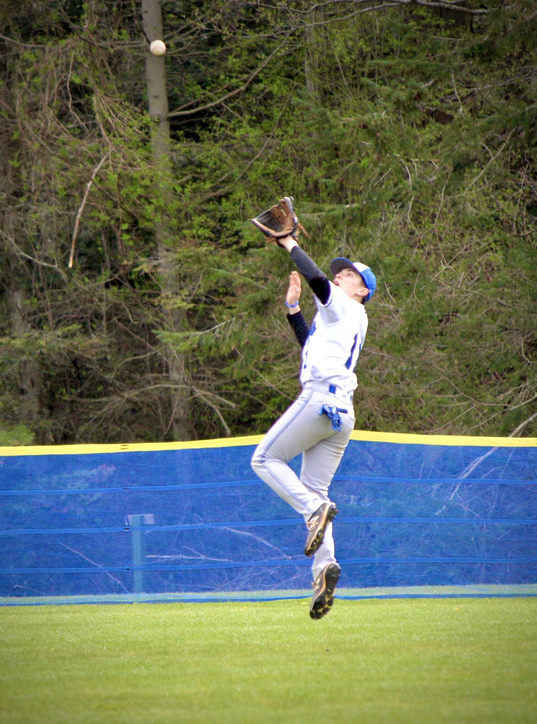 Corey Wiscomb photo.
Orion Meskew catches a deep fly ball.