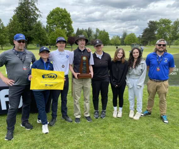 From left to right: Coach Chris Sutton, Joseph Anderson, Joshua Spinner, Sam Sutton, Lili Malo, Chloe Anderson-Cleveland, Vera Sasan, and coach Ryan Kennedy.