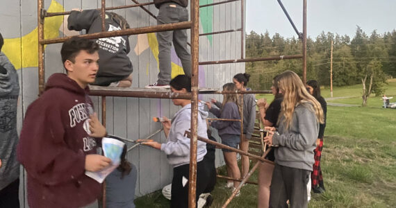 Cienna Richardson photo.
Seniors painting the barn on Orcas Road.