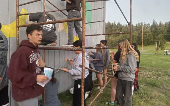 Cienna Richardson photo.
Seniors painting the barn on Orcas Road.