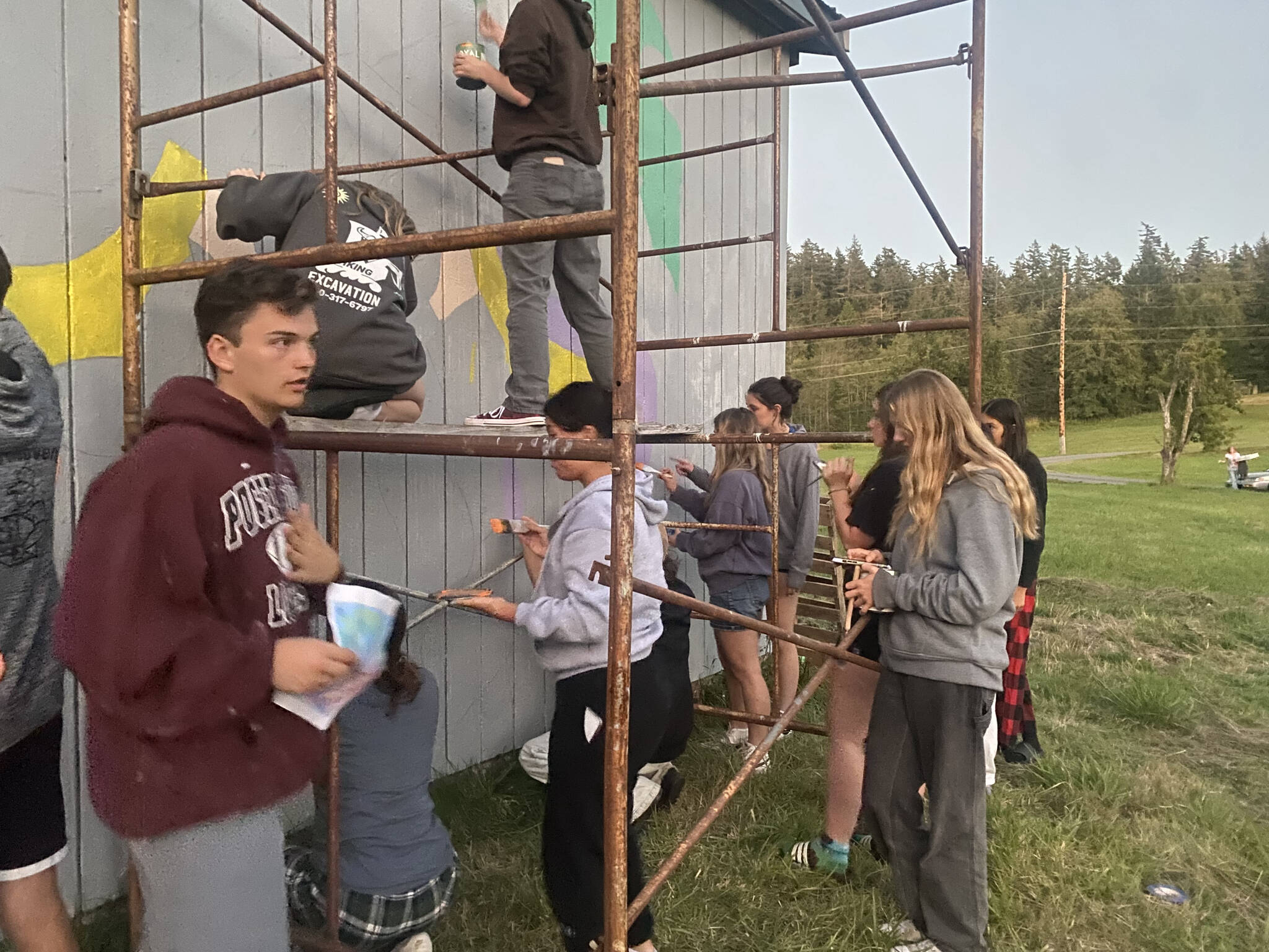 Cienna Richardson photo.
Seniors painting the barn on Orcas Road.