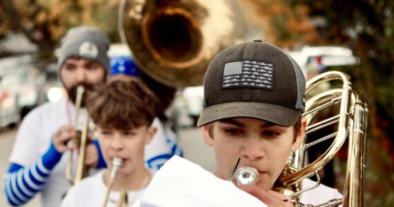 Corey Wiscomb photo.
Music Teacher Darren Dix (back left) lead the Marching Band through the streets of Eastsound and all the way to the stage on the Village Green where they performed for the Homecoming community festivities.