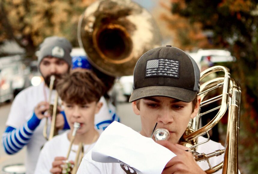 <p>Corey Wiscomb photo.</p>
                                <p>Music Teacher Darren Dix (back left) lead the Marching Band through the streets of Eastsound and all the way to the stage on the Village Green where they performed for the Homecoming community festivities.</p>