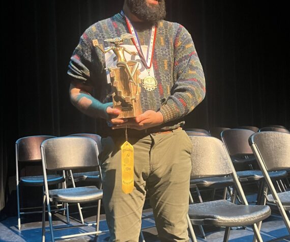 Colleen Smith Summers photo.
Pedro LopezDeVictoria with his spelling trophy.