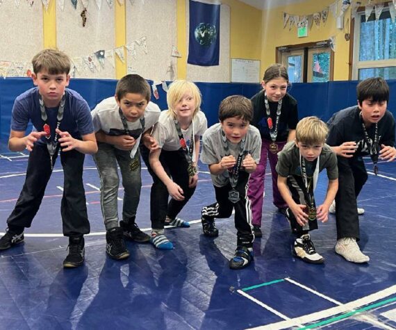 Wrestlers back at practice after returning from the WWKWL Novice Tournament in Stanwood. Pictured from left to right: Anston Feagins, Greyson Howard, David Nunez, Cru Hawley, Caden King, Aria Griffin, Elliot Wooding, Weston Wooding and Brooks Hawley.